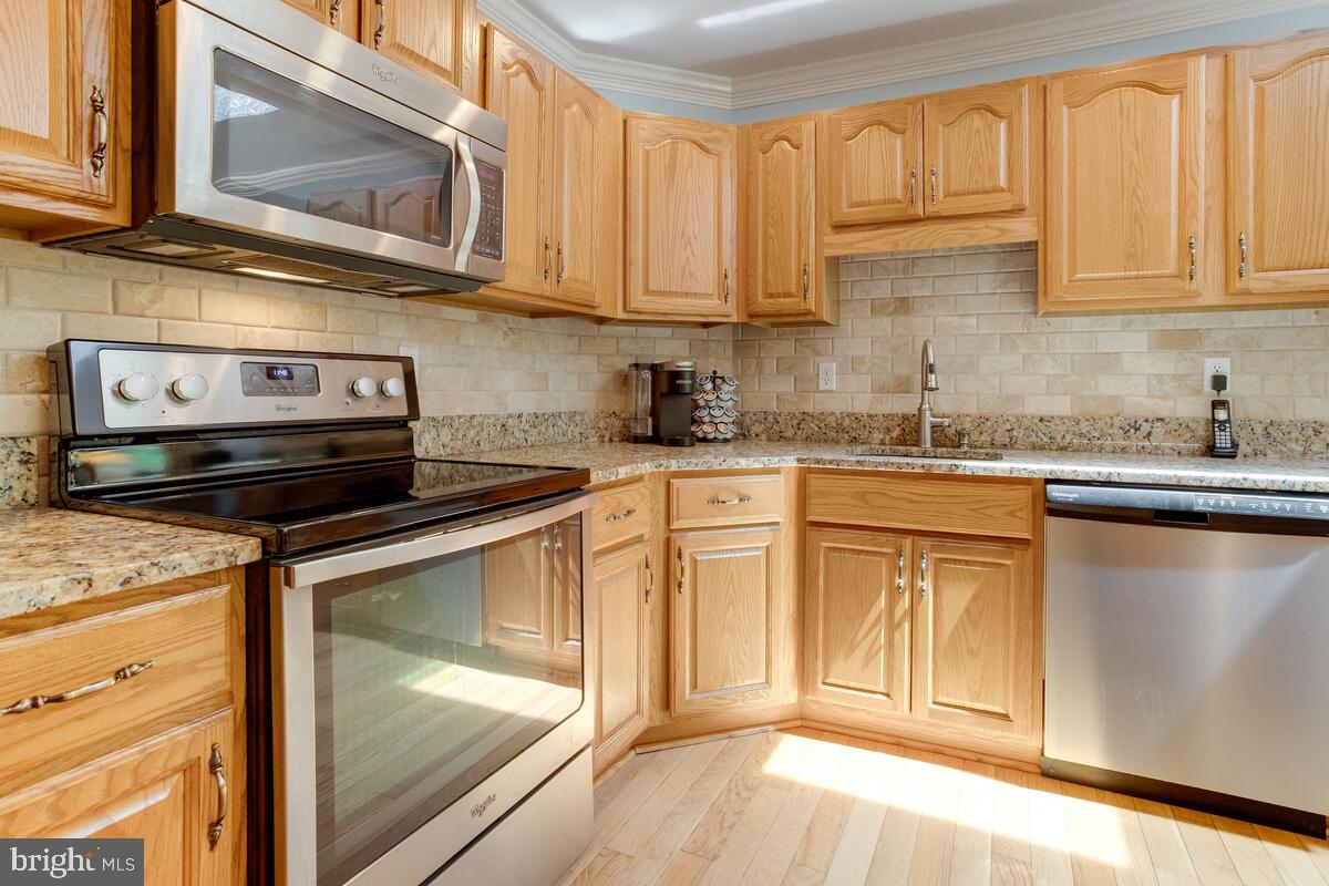 8429 Bussenius Road Pasadena, MD 21122 - Photo 21 of 46 Sleek Stainless Appliances Which CONVEY!