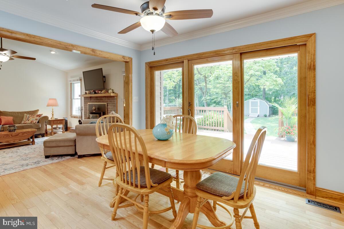 8429 Bussenius Road Pasadena, MD 21122 - Photo 23 of 46 Adjoining Casual Dining Area Spilling Out to Deck