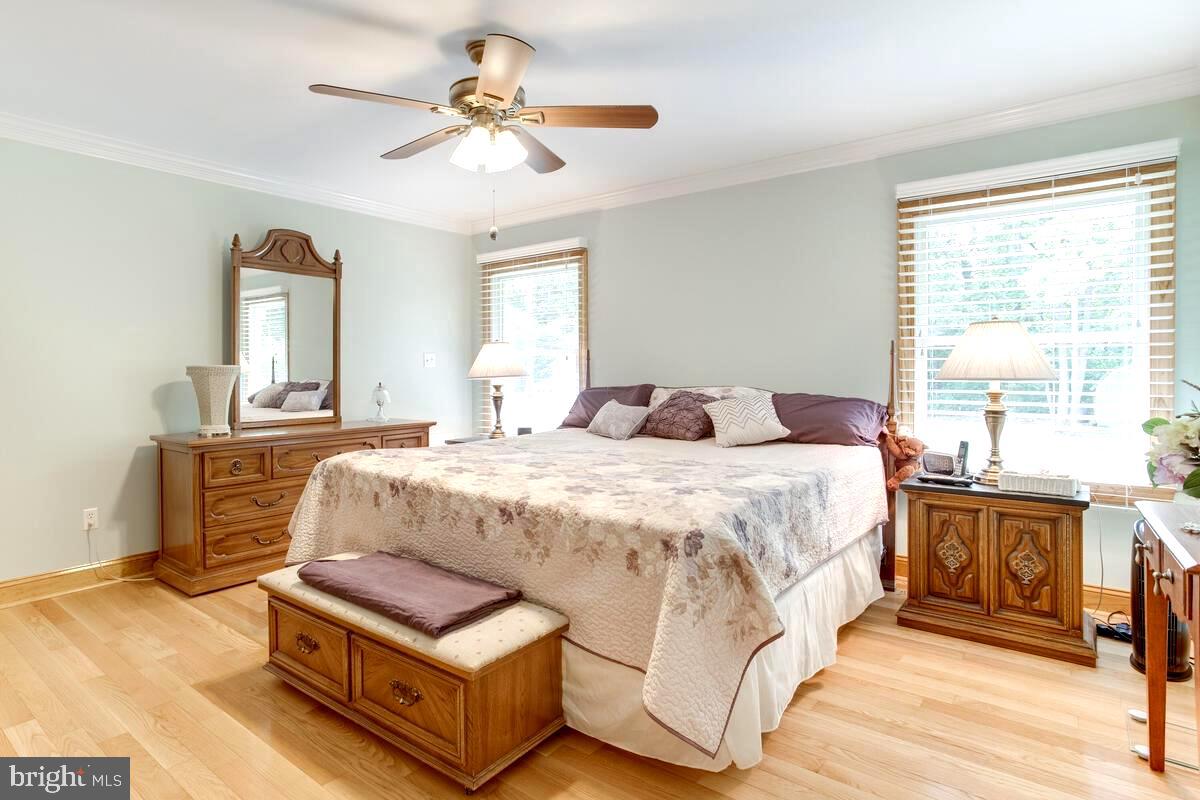 8429 Bussenius Road Pasadena, MD 21122 - Photo 28 of 46 Light-Filled Primary Bedroom Suite with Bath