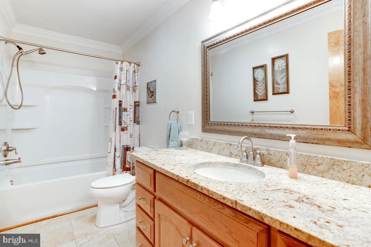 8429 Bussenius Road Pasadena, MD 21122 - Photo 35 of 46 Updated Travertine Tile & Granite Hall Full Bath