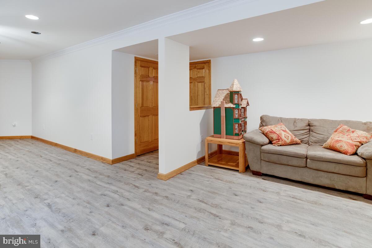 8429 Bussenius Road Pasadena, MD 21122 - Photo 36 of 46 Partially Finished Basement with Family Room