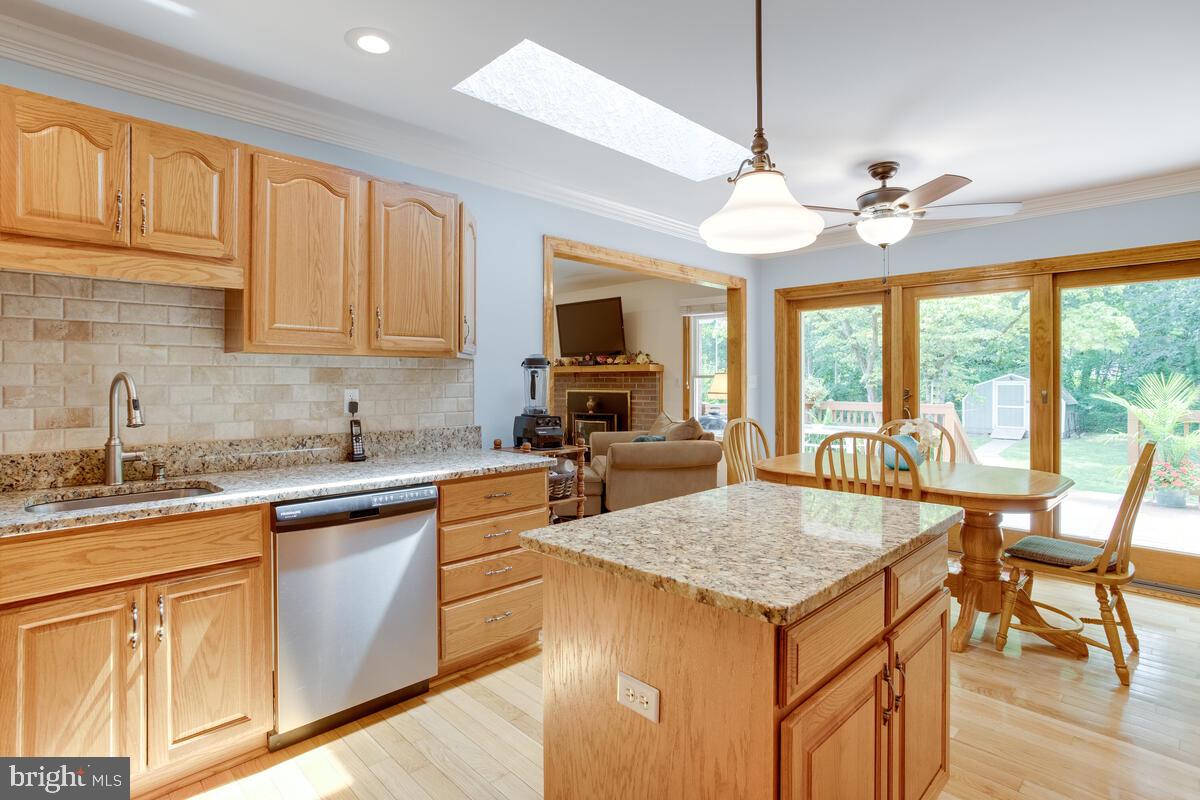 8429 Bussenius Road Pasadena, MD 21122 - Photo 5 of 46 Remodeled Stainless & Granite Kitchen with Island