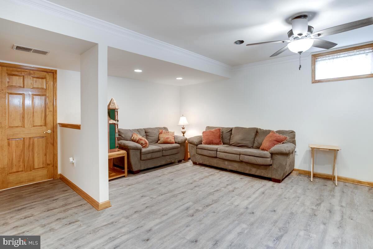 8429 Bussenius Road Pasadena, MD 21122 - Photo 9 of 46 Lower Level Family / Rec Room . Separate Exit