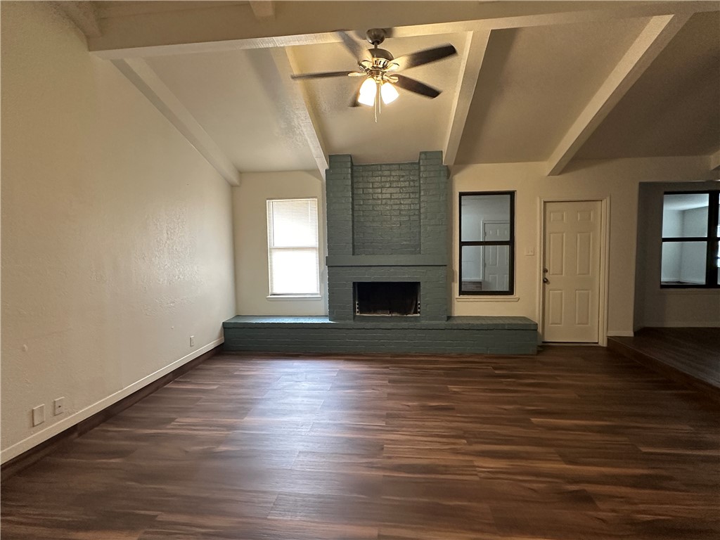 1502 Cheyenne Street Portland, TX 78374 - Photo 4 of 10 a view of empty room with wooden floor and fan