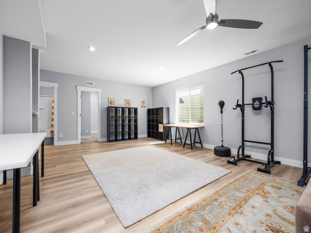 877 South Yarrow Drive Mapleton, UT 84664 - Photo 20 of 46 Spacious room featuring wood-finish flooring, recessed lighting, and a modern ceiling fan