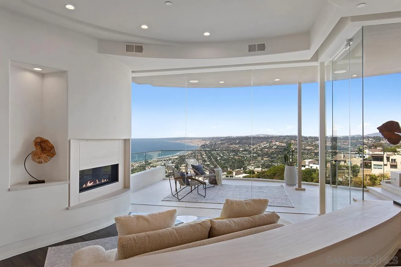 7447 Hillside Drive La Jolla, CA 92037 - Photo 13 of 55 a living room with furniture and a fireplace