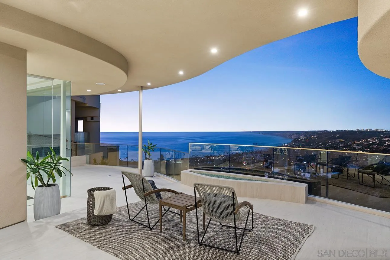 7447 Hillside Drive La Jolla, CA 92037 - Photo 16 of 55 a view of kitchen with kitchen island dining table and chairs