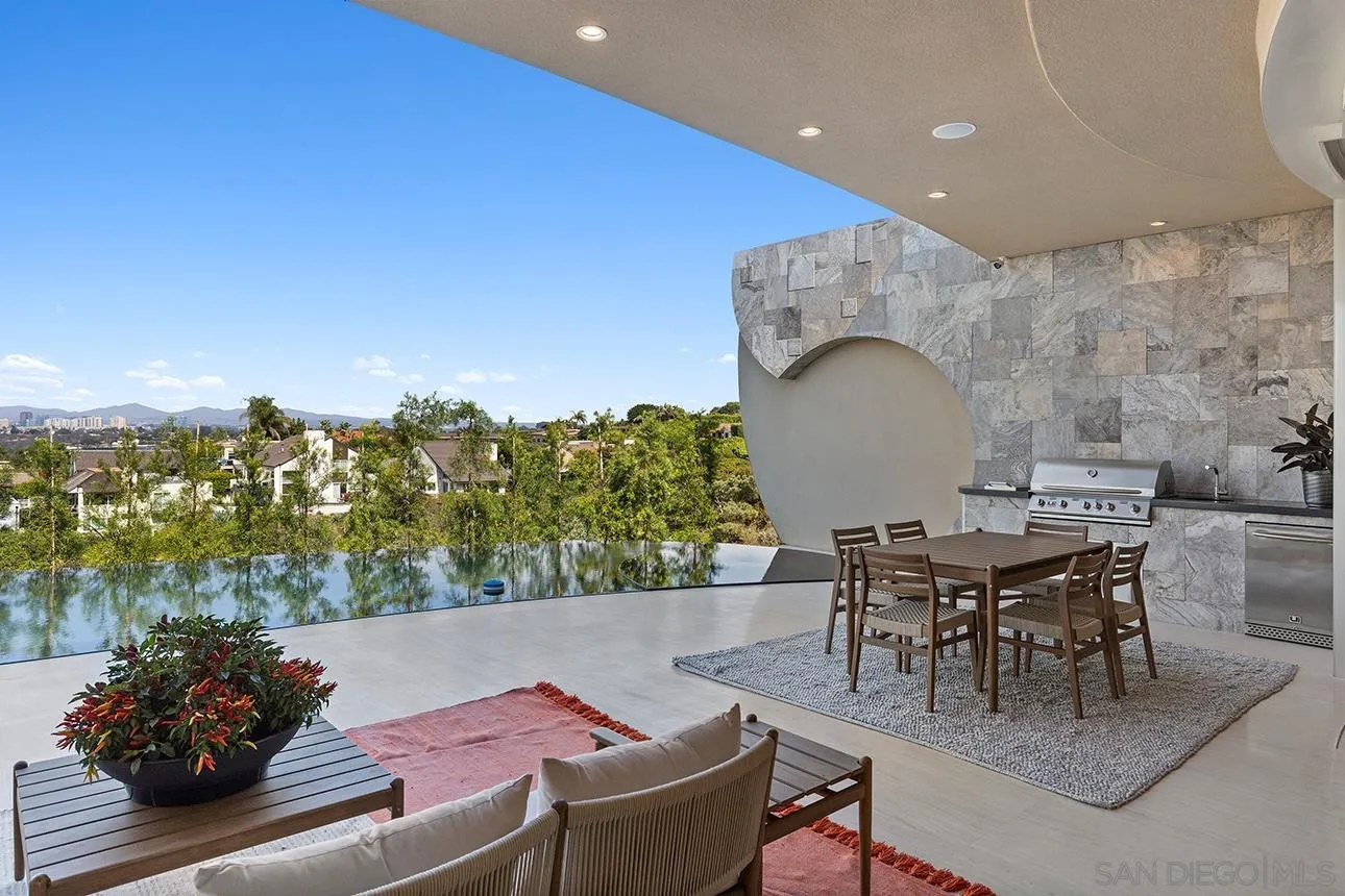 7447 Hillside Drive La Jolla, CA 92037 - Photo 35 of 55 an outdoor living area with furniture and a potted plant