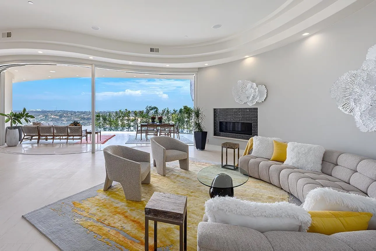 7447 Hillside Drive La Jolla, CA 92037 - Photo 40 of 55 a living room with furniture and a flat screen tv