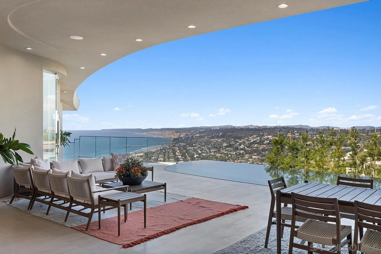 7447 Hillside Drive La Jolla, CA 92037 - Photo 6 of 55 a terrace with outdoor seating and city view