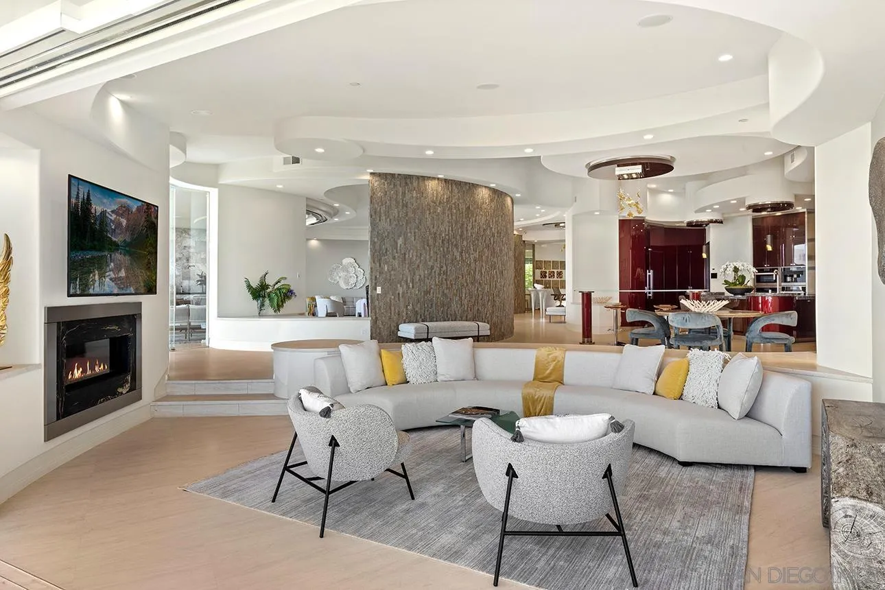 7447 Hillside Drive La Jolla, CA 92037 - Photo 9 of 55 a living room with furniture and a fireplace