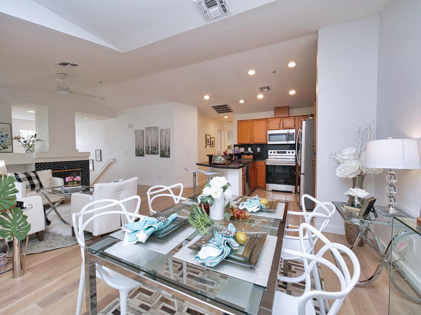 1302 Dawn Court San Ramon, CA 94583 - Photo 41 of 100 a view of a dining room with furniture a kitchen and chandelier