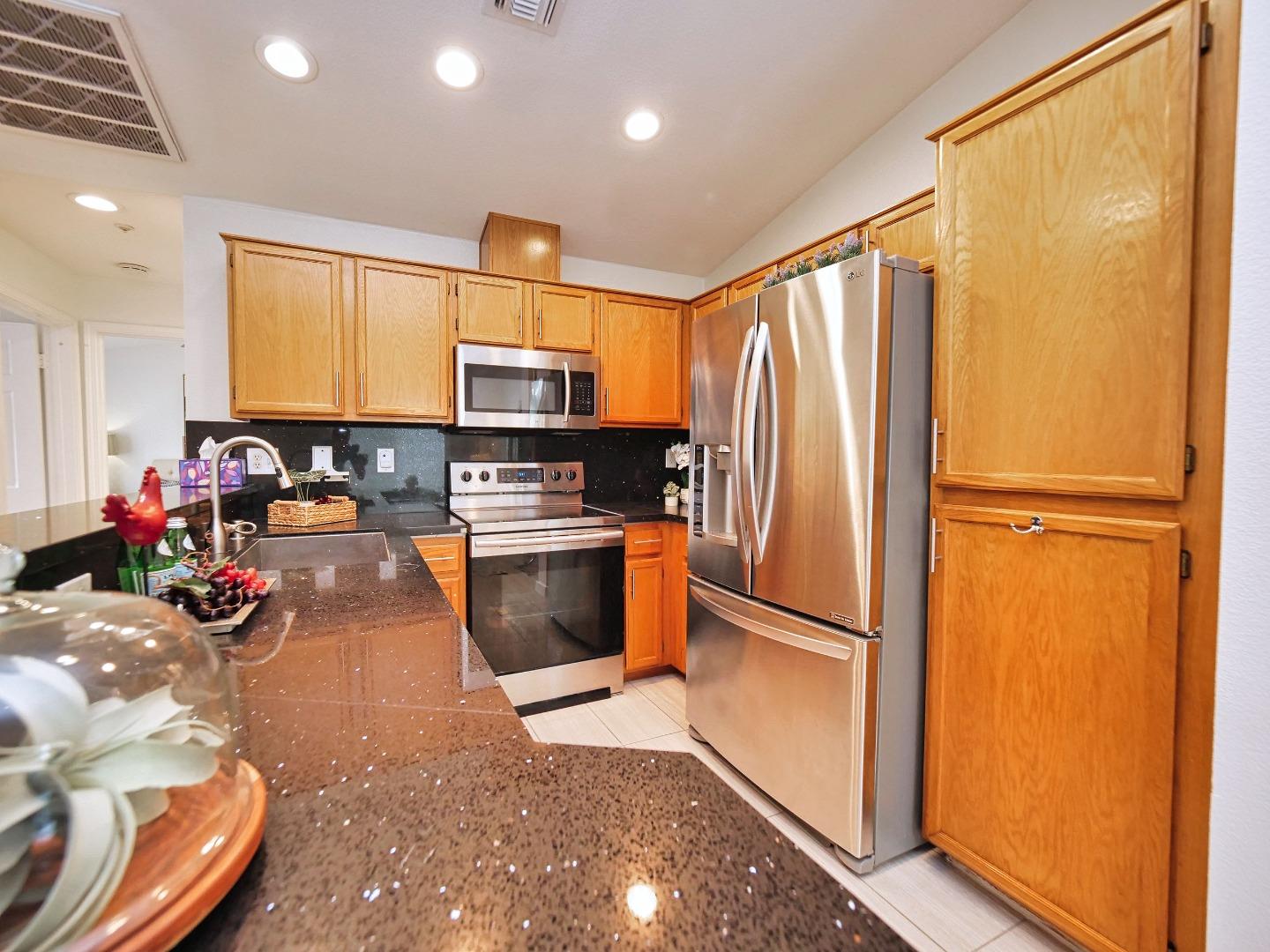 1302 Dawn Court San Ramon, CA 94583 - Photo 55 of 100 a kitchen with stainless steel appliances a refrigerator and a sink