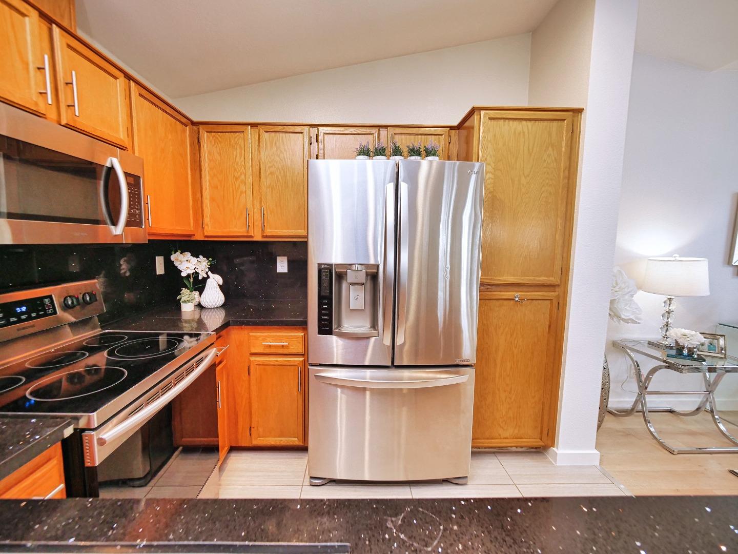 1302 Dawn Court San Ramon, CA 94583 - Photo 56 of 100 a kitchen with a refrigerator and a stove top oven