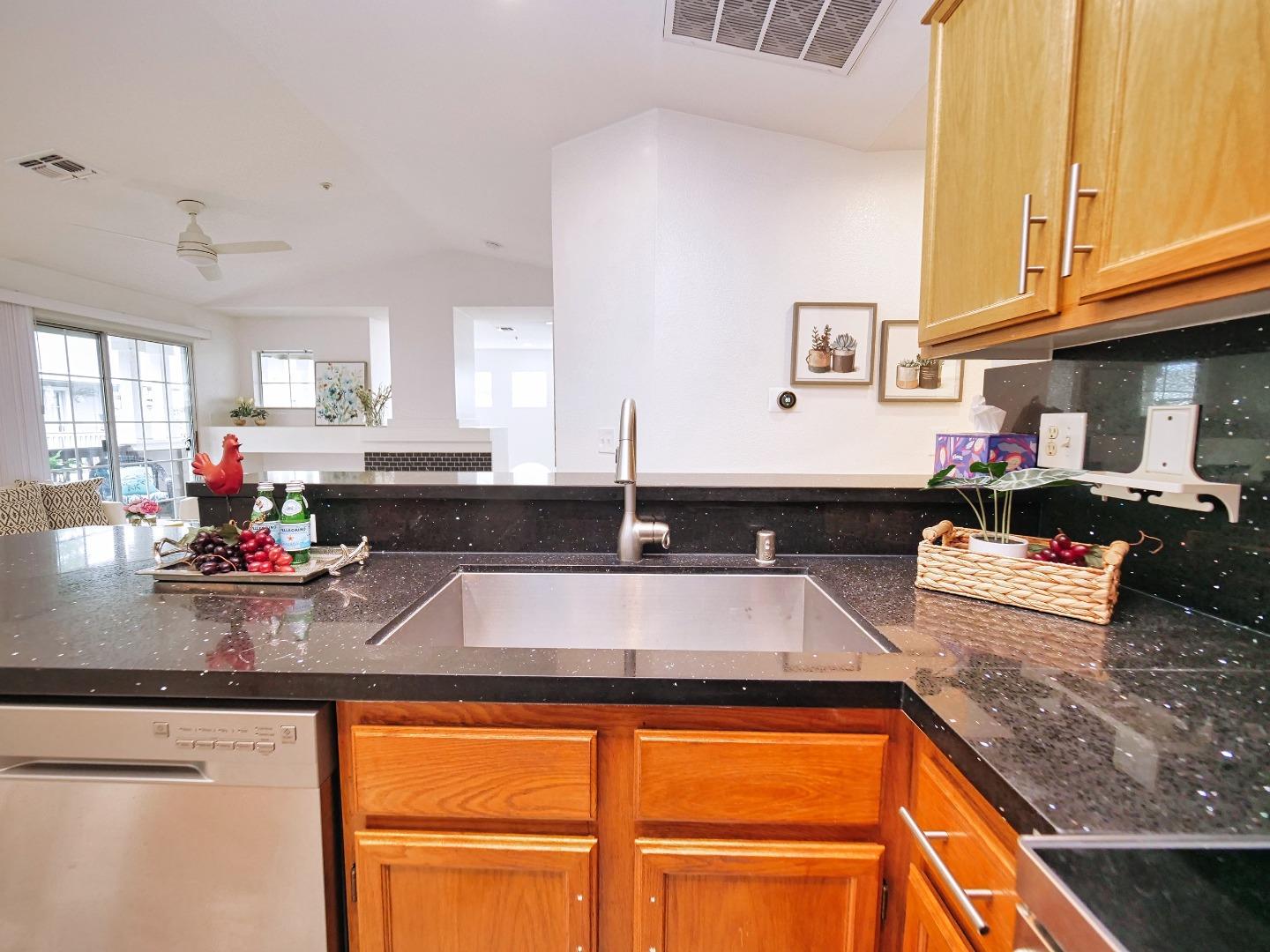 1302 Dawn Court San Ramon, CA 94583 - Photo 58 of 100 a kitchen with stainless steel appliances granite countertop a sink dishwasher and cabinets with wooden floor