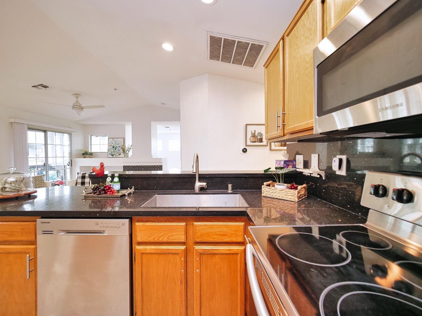1302 Dawn Court San Ramon, CA 94583 - Photo 59 of 100 a kitchen with stainless steel appliances granite countertop a stove and a sink