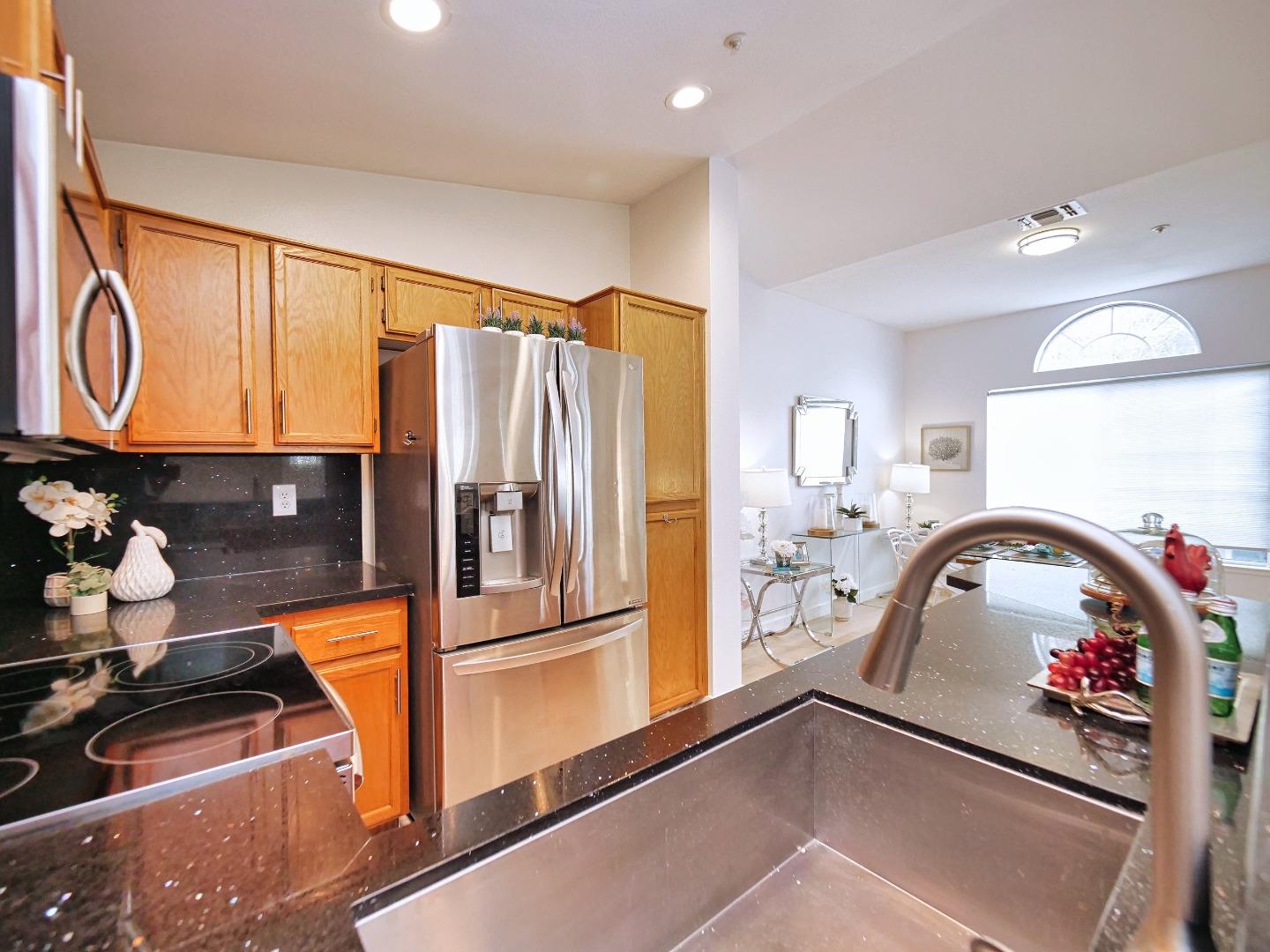 1302 Dawn Court San Ramon, CA 94583 - Photo 61 of 100 a kitchen with a refrigerator and a sink
