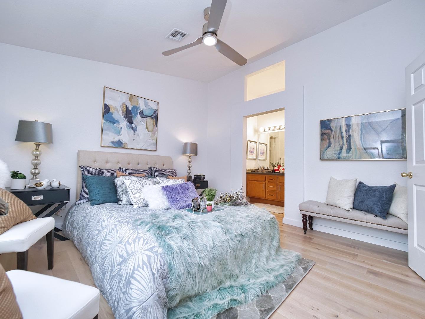 1302 Dawn Court San Ramon, CA 94583 - Photo 65 of 100 a bedroom with a large bed and a couch