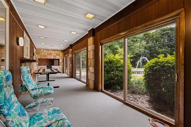 a lobby with furniture and floor to ceiling window