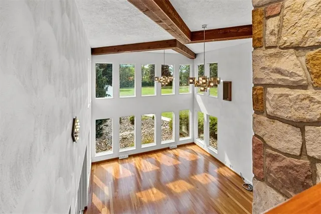a view of an entryway with wooden floor
