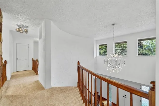 a view of a hallway with windows