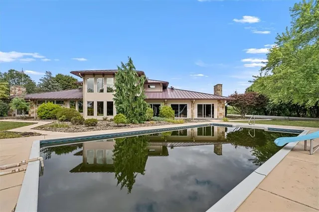a house view with a sitting space and garden view