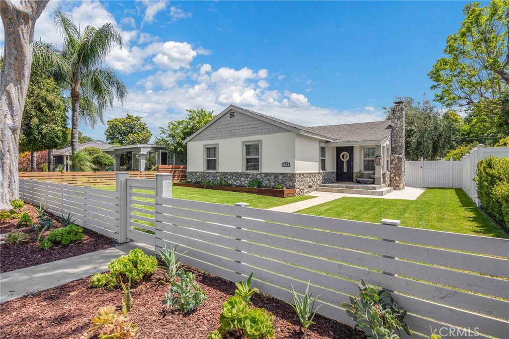 a view of house with swimming pool outdoor seating