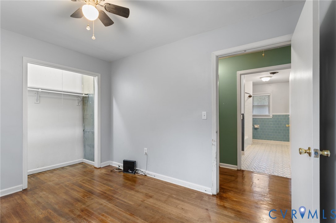 8141 Military Road Amelia Court House, VA 23002 - Photo 23 of 40 wooden floor in an empty room with a window