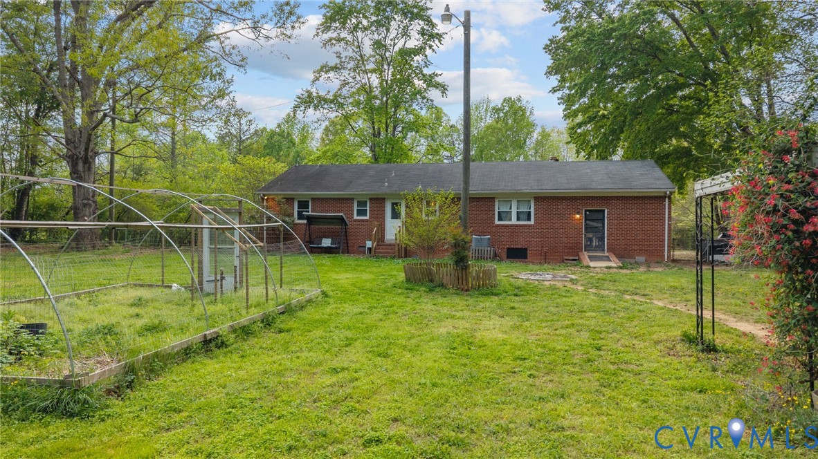8141 Military Road Amelia Court House, VA 23002 - Photo 30 of 40 a view of a house with a yard
