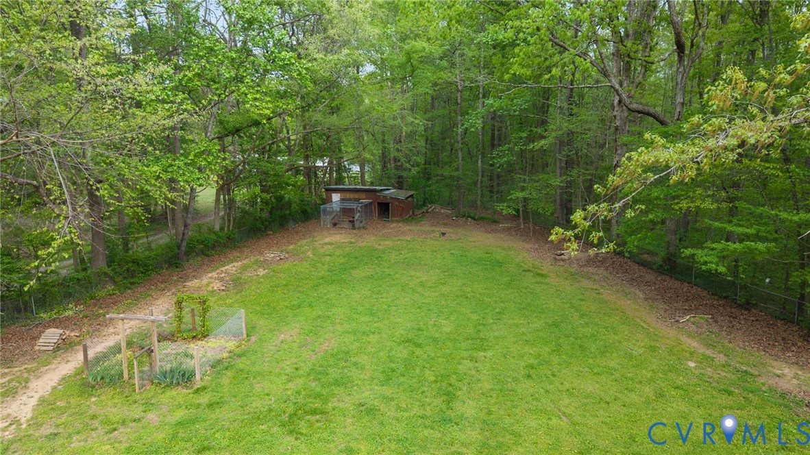 8141 Military Road Amelia Court House, VA 23002 - Photo 34 of 40 a view of a chair and table in the garden