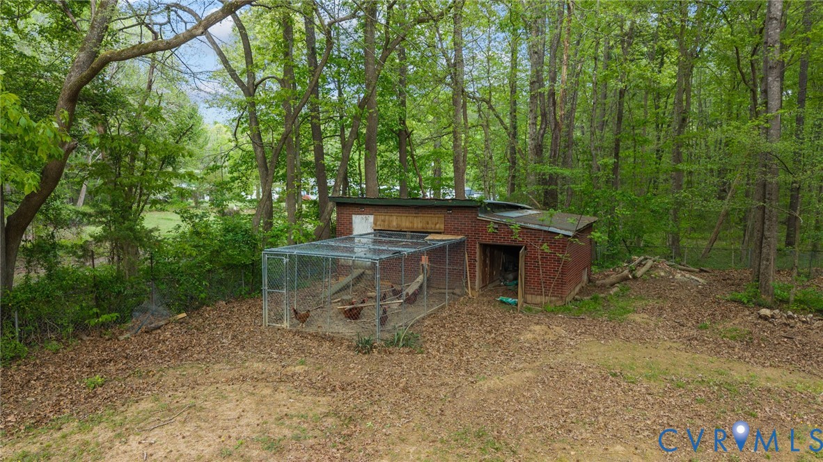8141 Military Road Amelia Court House, VA 23002 - Photo 35 of 40 a view of a wooden deck with large trees
