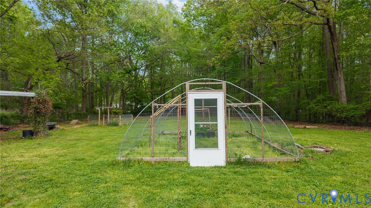 8141 Military Road Amelia Court House, VA 23002 - Photo 38 of 40 a view of a house with a big yard and a small park
