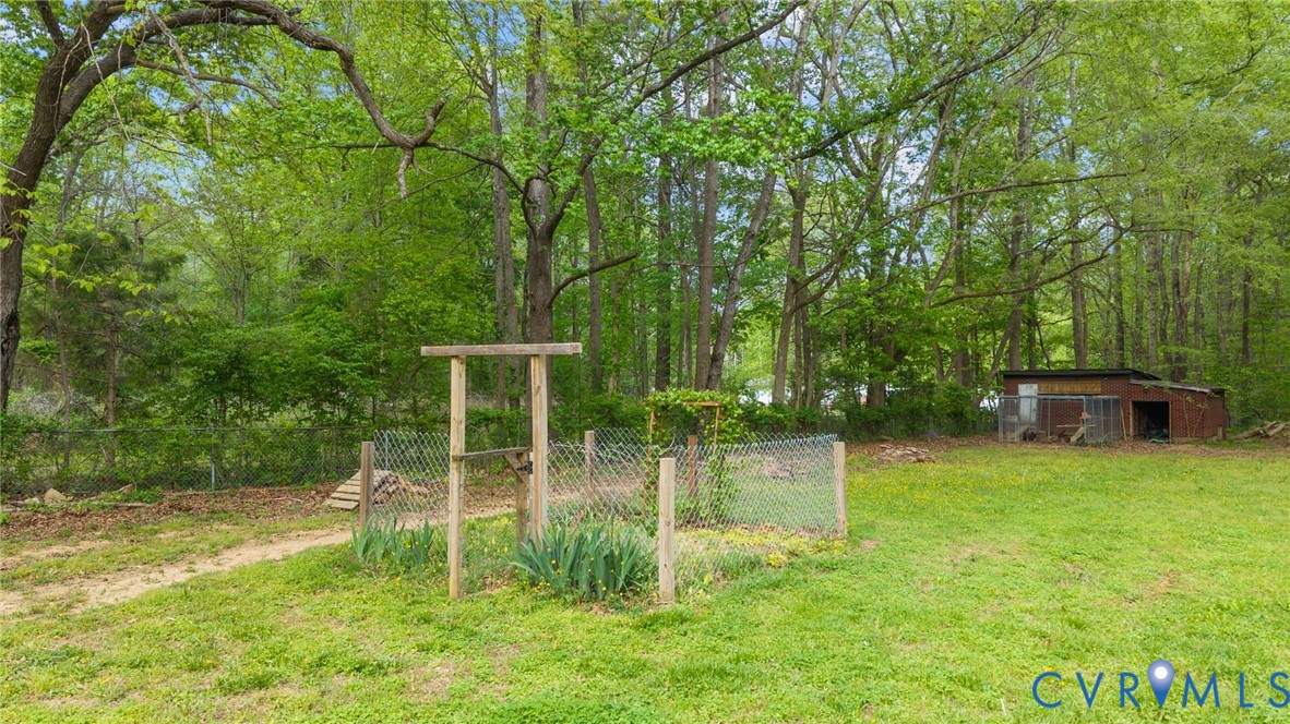 8141 Military Road Amelia Court House, VA 23002 - Photo 39 of 40 a backyard of a house with lots of green space
