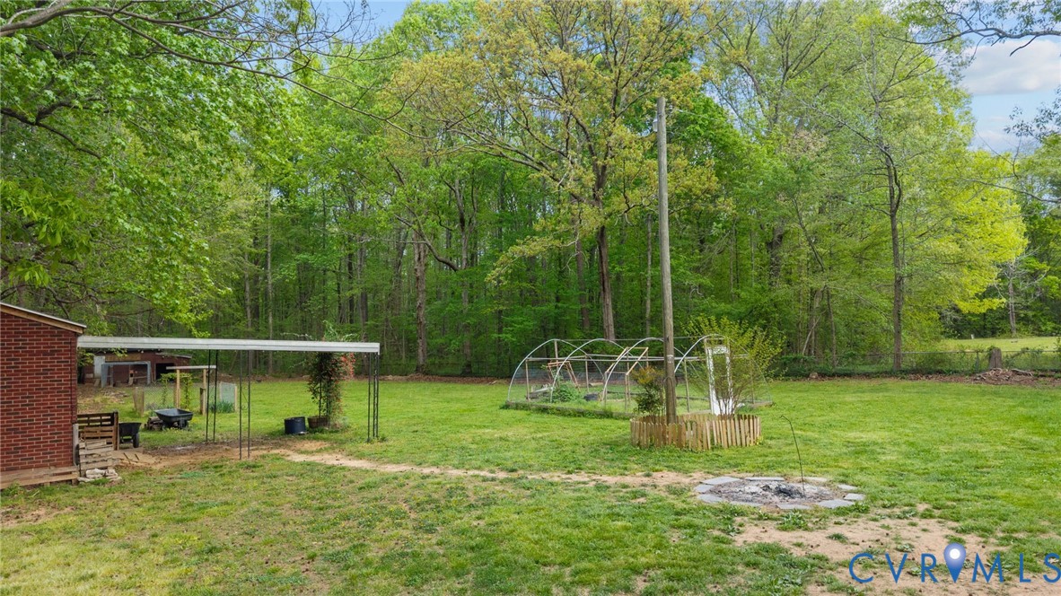 8141 Military Road Amelia Court House, VA 23002 - Photo 40 of 40 a view of outdoor space with deck and yard