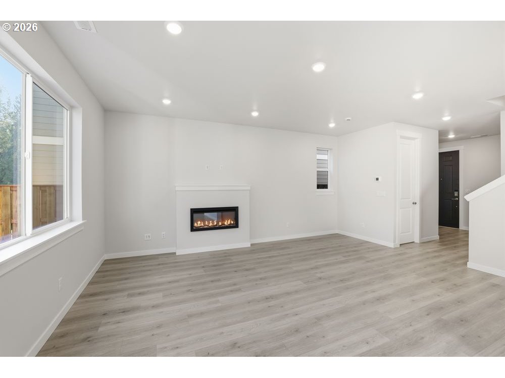 3115 Southwest 4th Avenue Battle Ground, WA 98604 - Photo 18 of 20 a view of an empty room with wooden floor
