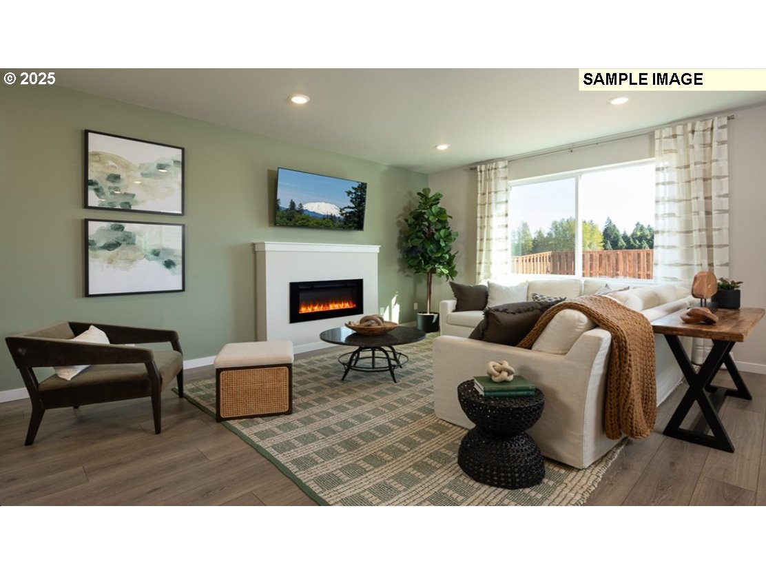 3115 Southwest 4th Avenue Battle Ground, WA 98604 - Photo 6 of 20 a living room with furniture a large window and a fireplace
