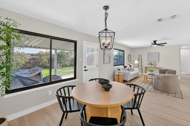 a view of a dining room with furniture window and outside view
