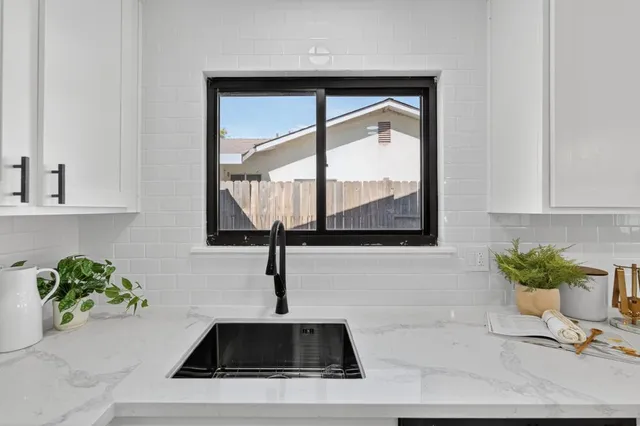 a kitchen with a sink and a window