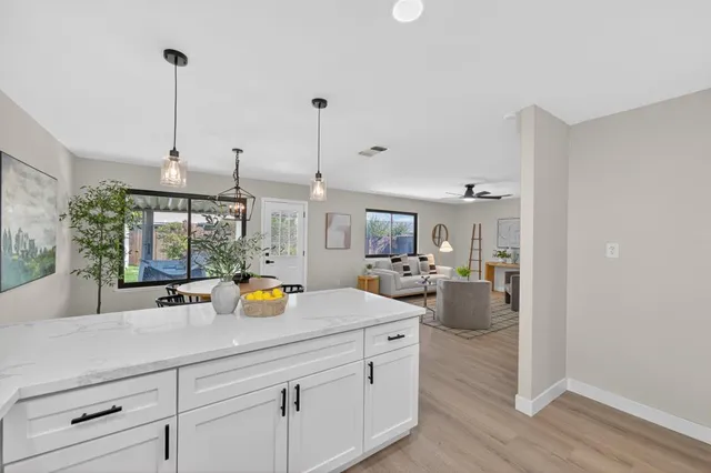 a kitchen with sink and cabinets