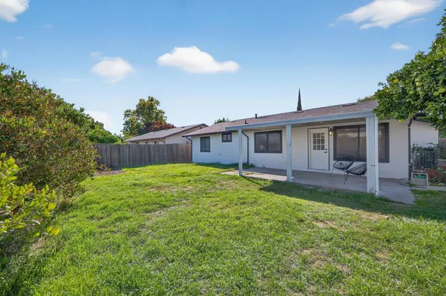 a bathroom with a granite countertop sink and mirror
