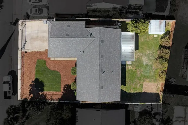 an aerial view of a houses with outdoor space