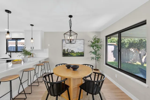a view of a dining room with furniture window and outside view