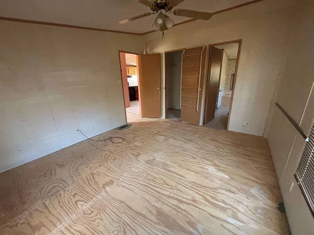 361 Cumberland Circle Murchison, TX 75778 - Photo 13 of 40 a view of a room with a chandelier fan and entryway