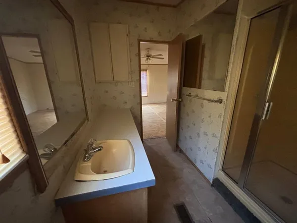 a bathroom with a sink and mirror