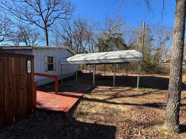 a view of a backyard with a patio