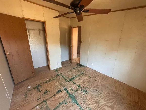 a view of an empty room and a window