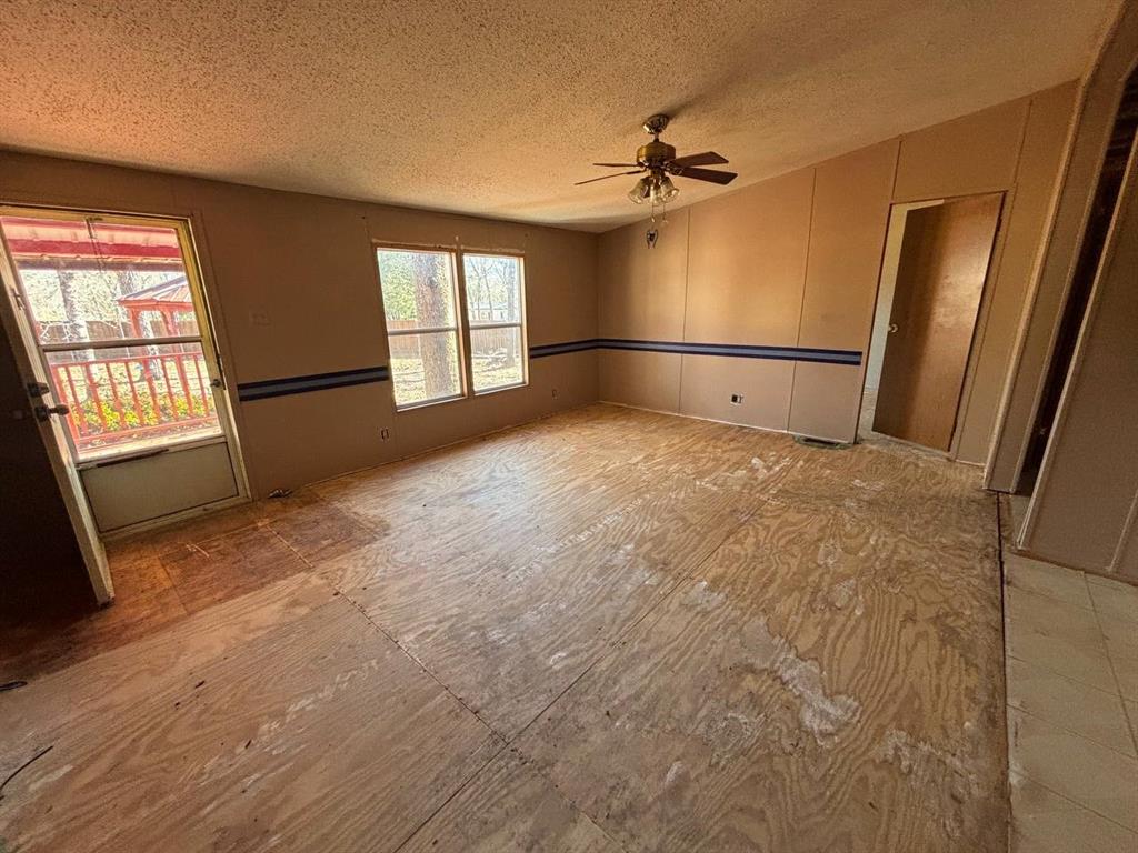 361 Cumberland Circle Murchison, TX 75778 - Photo 10 of 40 an empty room with windows and entrance