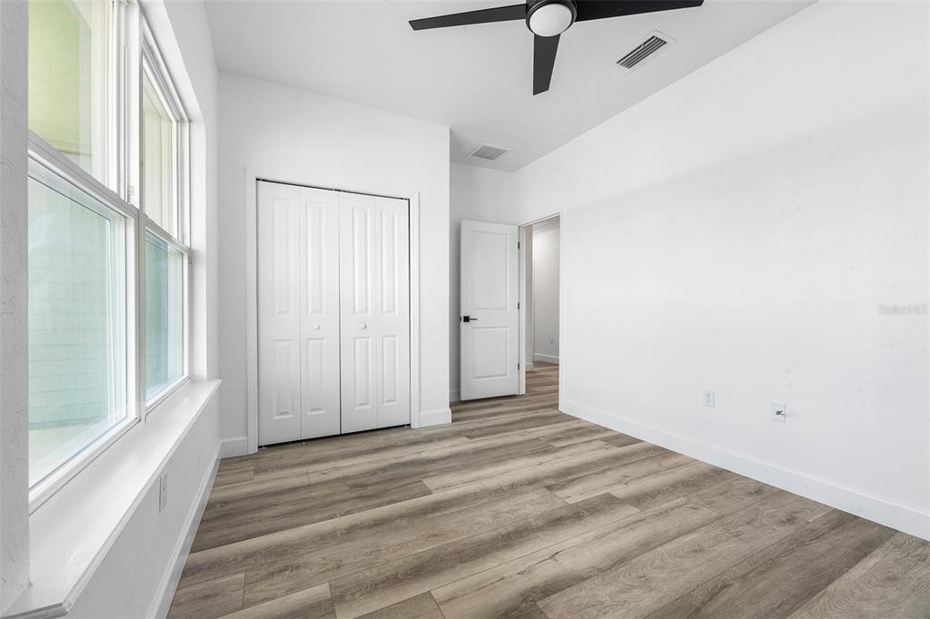 6723 Southwest 15 Place Gainesville, FL 32607 - Photo 12 of 24 a view of a livingroom with wooden floor and window