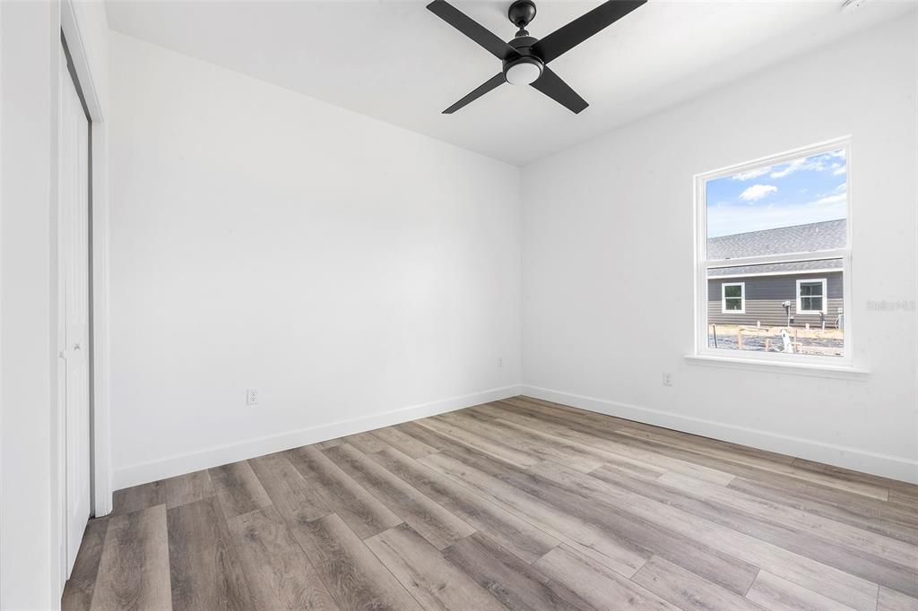 6723 Southwest 15 Place Gainesville, FL 32607 - Photo 13 of 24 a view of a room with a window and a ceiling fan
