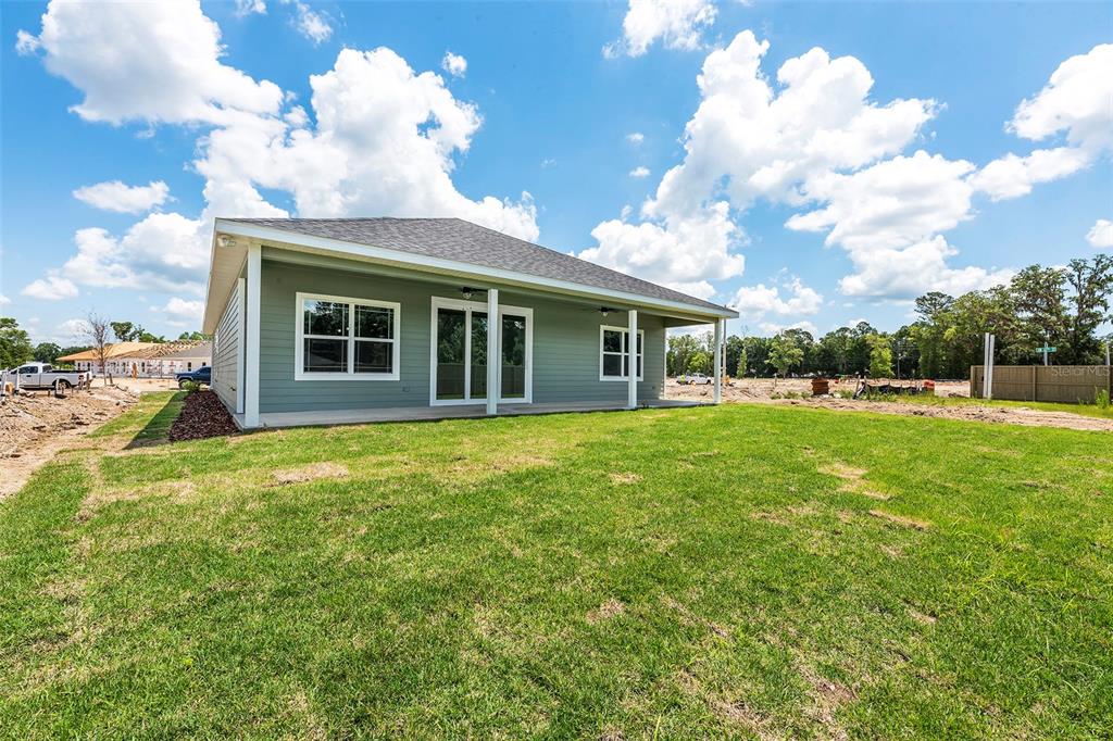 6723 Southwest 15 Place Gainesville, FL 32607 - Photo 23 of 24 a view of a house with backyard and garden